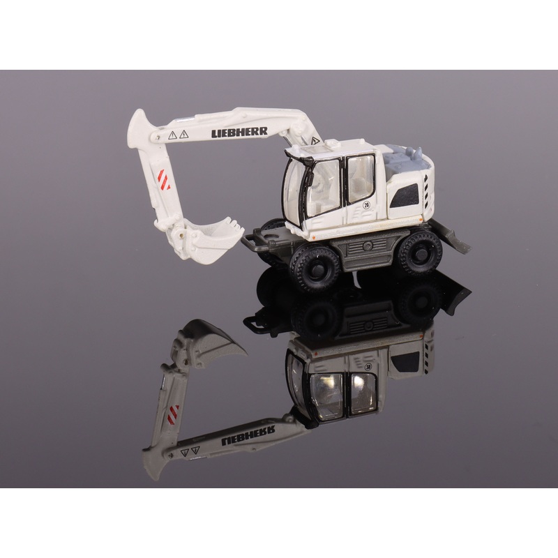 Liebherr compact excavator with backhoe
